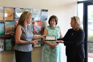 Marcie Boyle is presented with a plaque establishing RSVP Events & Travel as a member of the Chesterfield Chamber of Commerce.  Marcie Boyle with Sandy Zingrich and Bridget Nation.